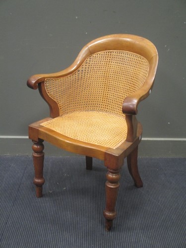 Lot 511 - An early Victorian walnut bergere arm chair