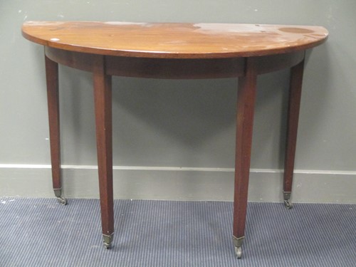 Lot 532 - A George IV mahogany demi lune table; and a...