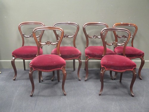 Lot 559 - A set of six Victorian rosewood balloon back...