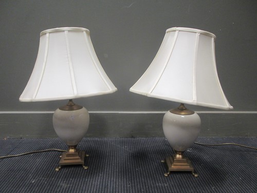 Lot 580 - A pair of ovoid and brass mounted table lamps