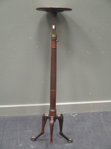 Lot 591 - A George III mahogany adjustable torchere...