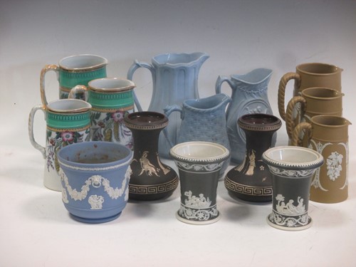 Lot 83 - A collection of relief moulded jugs, a game...