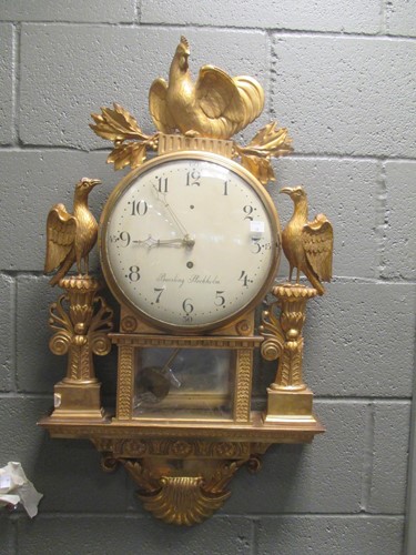 Lot 572 - A 19th century Swedish giltwood wall clock by...