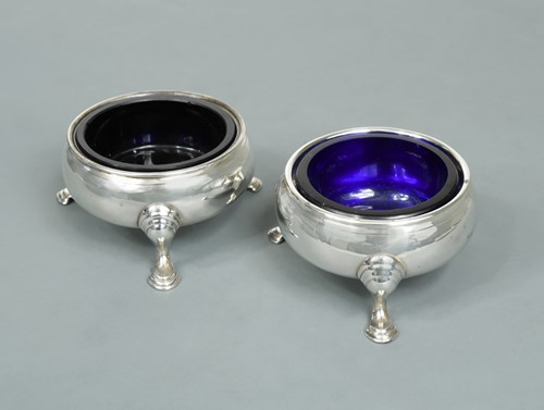 Lot 330 - A pair of George II silver cauldron salts