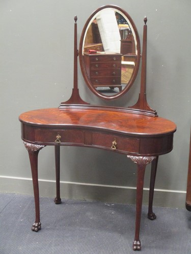 Lot 500 - An Edwardian flame mahogany kidney shape...