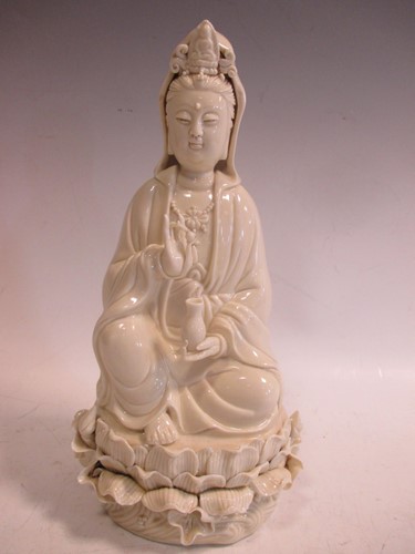 Lot 110 - Dehua white porcelain figure of Guanyin signed...