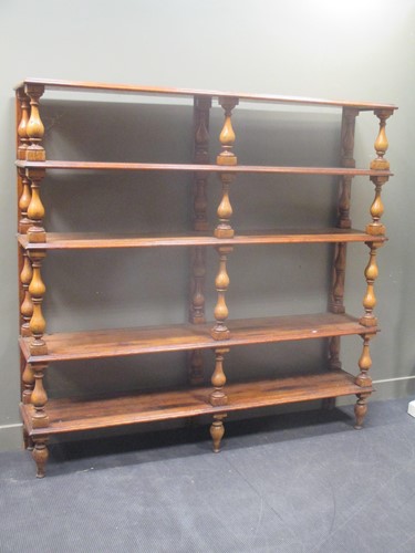 Lot 468 - A large open bookcase of five shelves on pine...