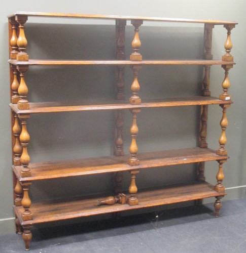 Lot 575 - A large open bookcase of five shelves on pine...