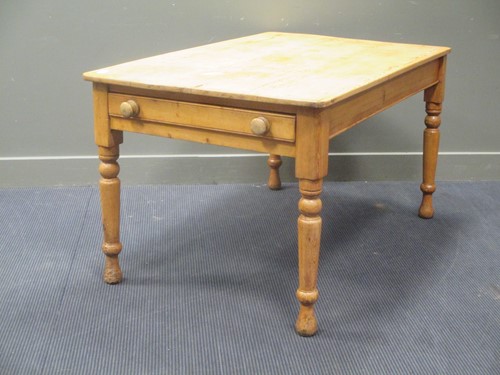 Lot 478 - A pine kitchen table, the rectangular top with...