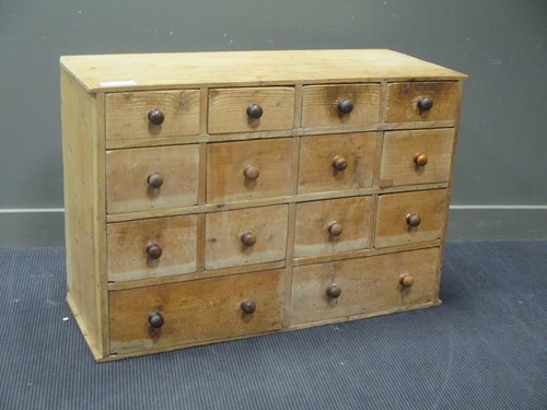 Lot 462 - A 20th century pine bank of fourteen drawers...
