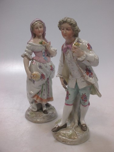 Lot 3 - A pair of porcelain figures of a lady and...