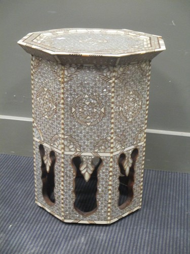 Lot 520 - A middle Eastern octagonal top table inlaid...