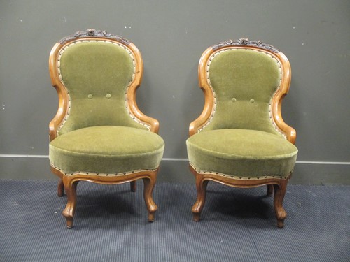 Lot 460 - A pair of Victorian walnut frame easy/ nursing...