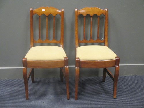Lot 521 - A pair of continental fruitwood chairs with...