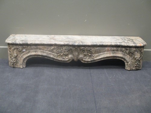 Lot 567 - A 19th century varigated marble fireplace top...