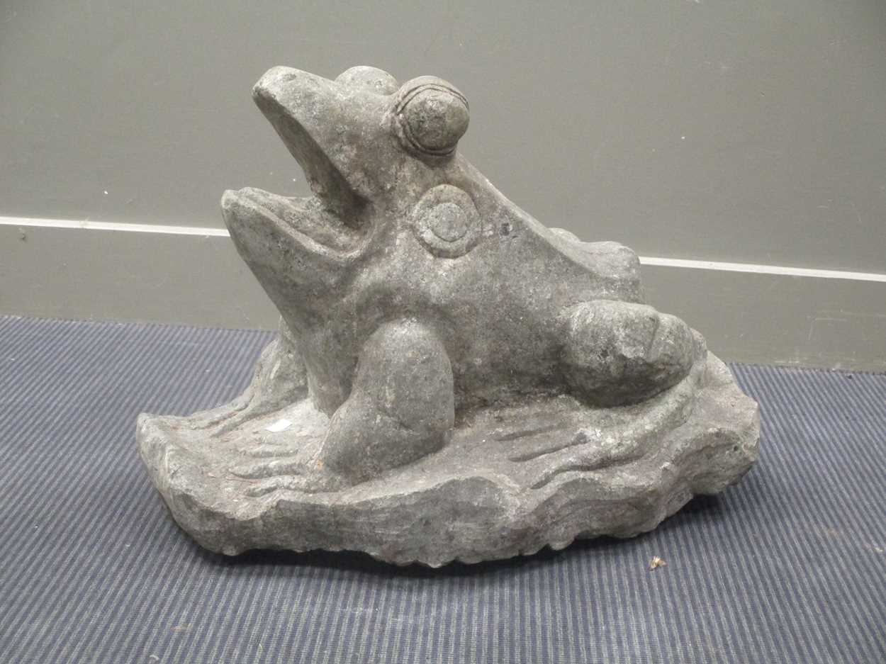Lot 434 - A carved granite figure of a frog, 49cm high,...