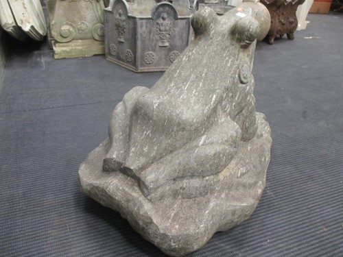 Lot 434 - A carved granite figure of a frog, 49cm high,...
