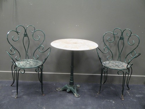 Lot 449 - A circular marble topped garden table on a...