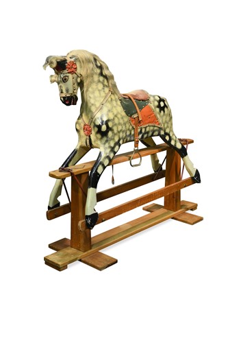 Lot 447 - A Dapple Grey painted wood rocking horse, 20th century