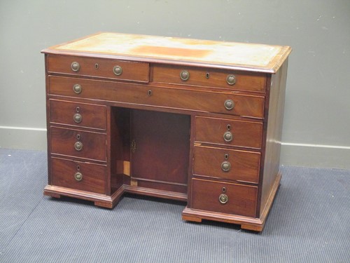 Lot 541 - A 19th century mahogany kneehole desk of nine...