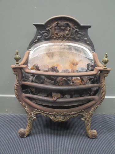 Lot 592 - A cast iron firegrate of sepentine form, 56cm...