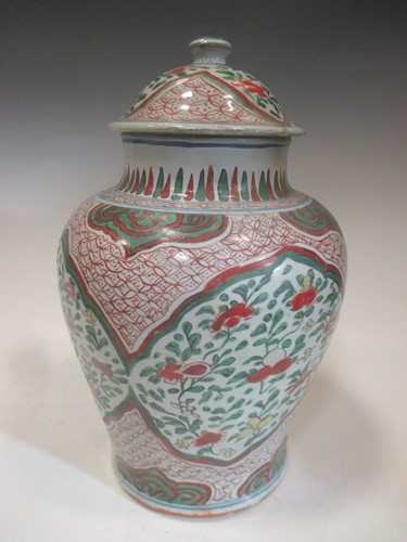 Lot 151 - A Wucai urn and cover - with restoration