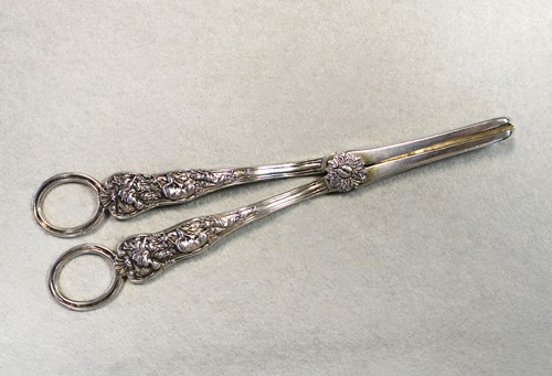 Lot 370 - A pair of Victorian silver grape shears with unusual decoration