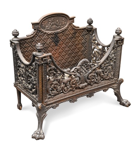 Lot 474 - A cast iron fire grate with lattice back