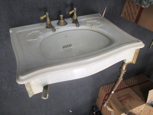 Lot 595 - A Bolding 'Simplex' wash basin with brass taps...