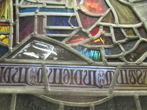 Lot 151 - A leaded stained glass panel of a medieval...