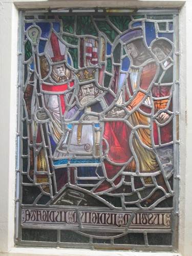 Lot 151 - A leaded stained glass panel of a medieval...