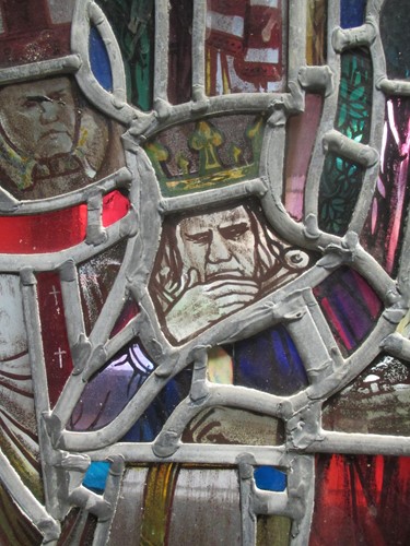 Lot 151 - A leaded stained glass panel of a medieval...