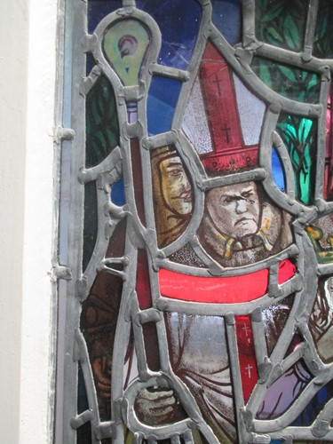 Lot 151 - A leaded stained glass panel of a medieval...