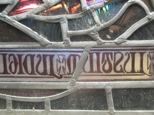 Lot 151 - A leaded stained glass panel of a medieval...