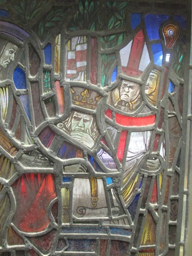 Lot 151 - A leaded stained glass panel of a medieval...