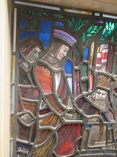 Lot 151 - A leaded stained glass panel of a medieval...