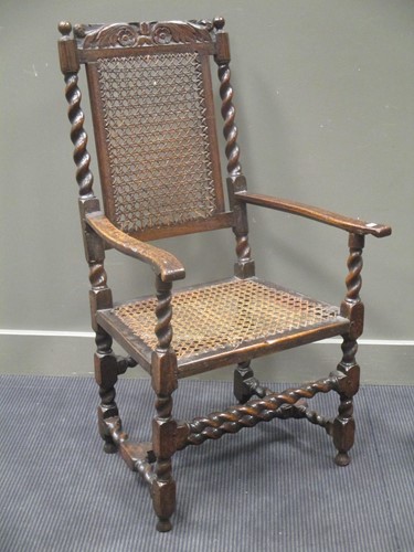 Lot 388 - A late 17th century high back arm chair