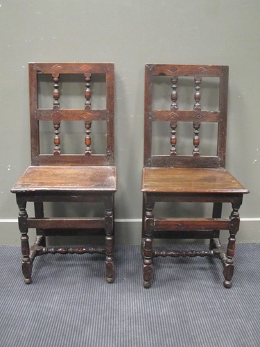 Lot 448 - pair of upright panel chairs in 17th century...