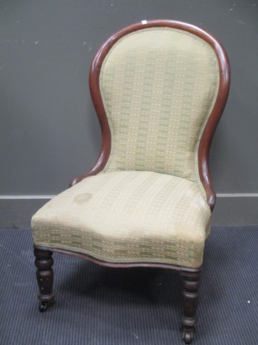 Lot 610 - A Victorian spoon back nursing chair together...