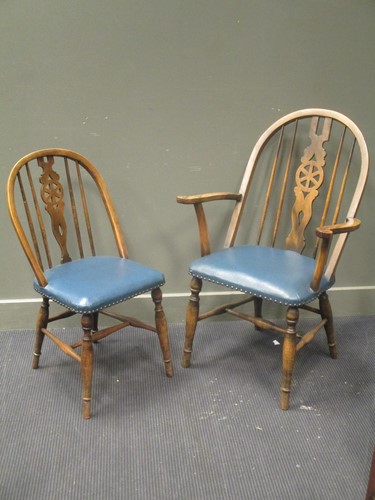 Lot 614 - A set of six 20th century wheel back dining...