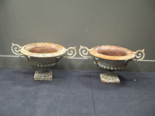 Lot 639 - A pair of wrought Iron urns 34cm high and...