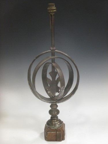 Lot 61 - An unusual sphere table lamp on wooden block base