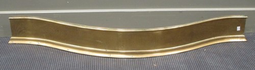 Lot 407 - A 19th century brass serpentine fender 125cm...