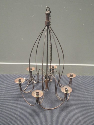 Lot 585 - A six branch iron candelabra on chain 82cm high