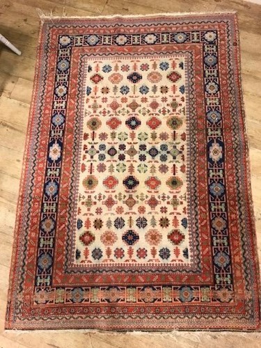 Lot 653 - A Kashan style beige ground rug with rows of...