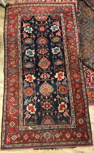 Lot 652 - A Bijar blue and red ground rug, 192 x 98cm