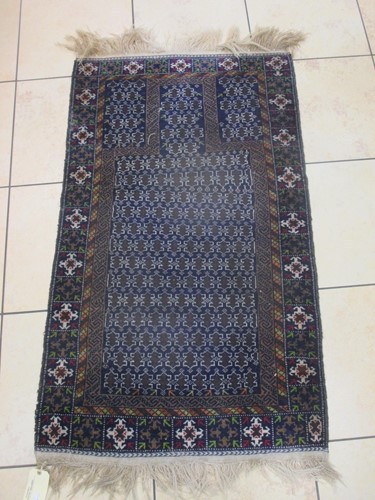 Lot 641 - Two Belouchi type rugs, another and a mat (4)