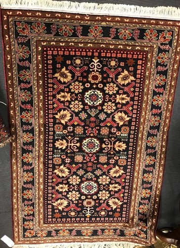 Lot 640 - A modern blue ground patterned wool rug, 205 x...