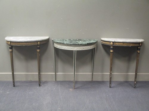 Lot 463 - A pair of ebonised and gilt console tables on...