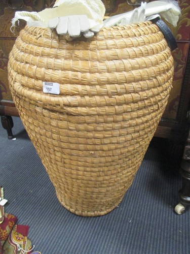 Lot 157 - A wicker laundry basket filled with lady's...